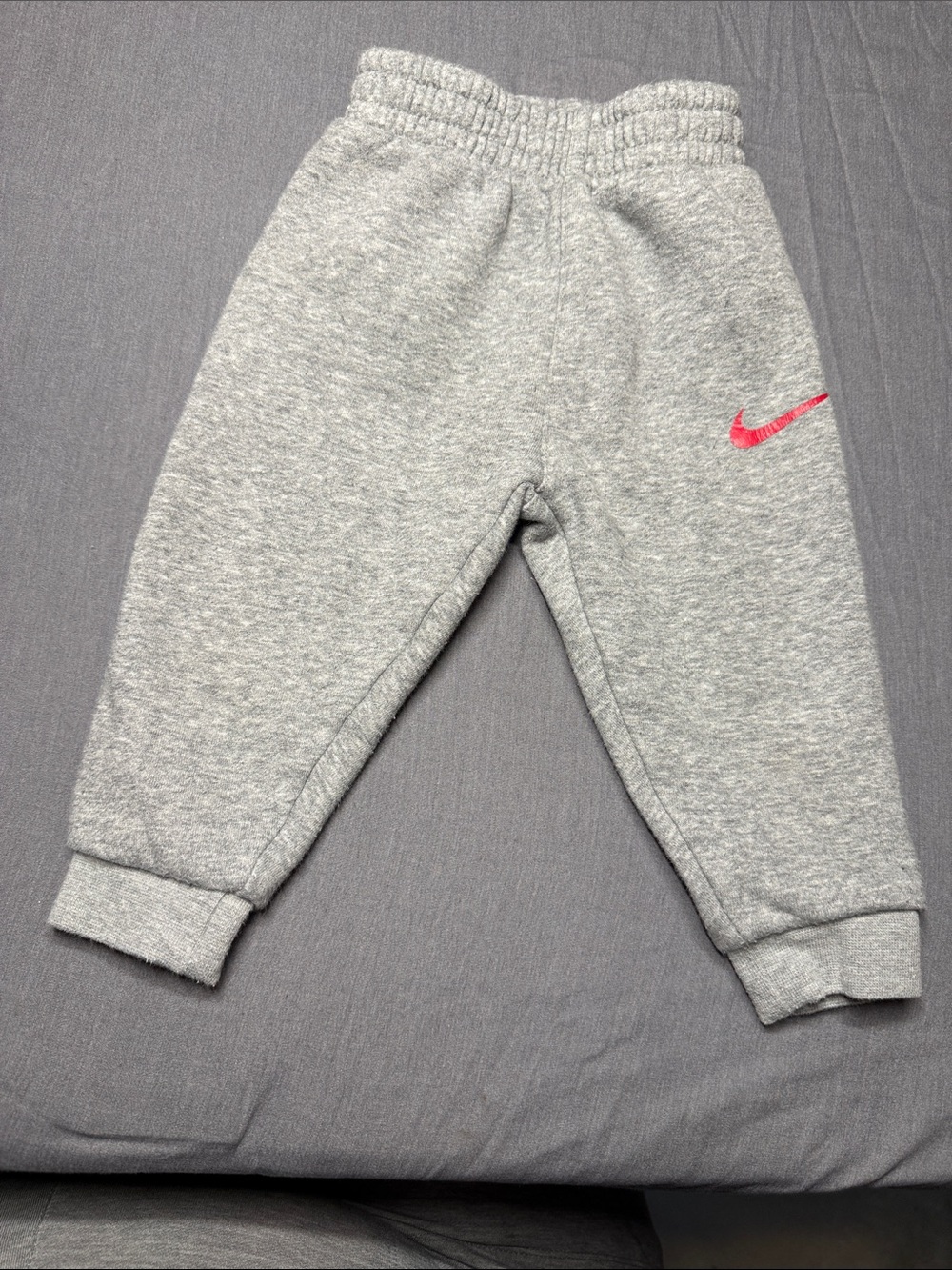 Nike Gray Kids Joggers with Red Swoosh